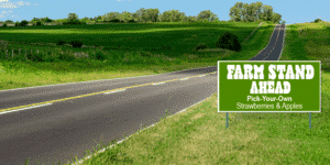 farm stand ahead sign on country road