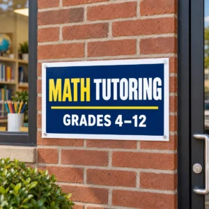 14 x 22 poly-coated math tutoring poster sign with a half-inch white border mounted on a brick wall